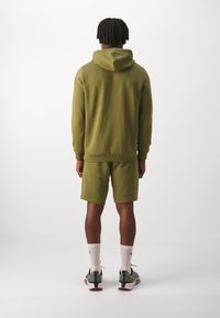 Puma SHORTS - Sportske kratke hlače - olive green