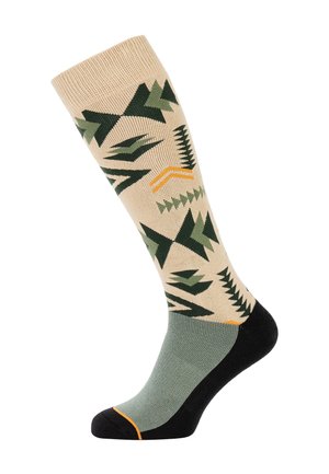 Kniesokken met een beige basis en groene boompatronen. Zwarte voetsectie met een oranje accent op de teen. Gemengd katoen materiaal.