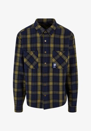 Plaid flannel shirt in navy and yellow, featuring two front pockets, button front, and a small logo on the left pocket. Soft texture.