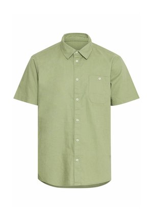 Rövid ujjú gombos ing világoszöld pamutból. Bal mellen zseb található, ívelt aljjal. Taktikai szövet, sima felülettel.