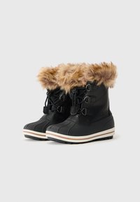 Stivali da neve neri con un risvolto in pelliccia sintetica color cannella, lacci frontali, materiale in gomma e suola bianca rigata. Motivo testurizzato sul gambale.