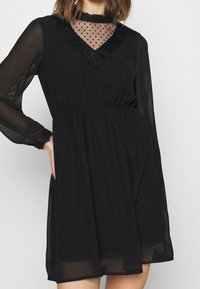 Vero Moda Koktejlové šaty / šaty na párty - black