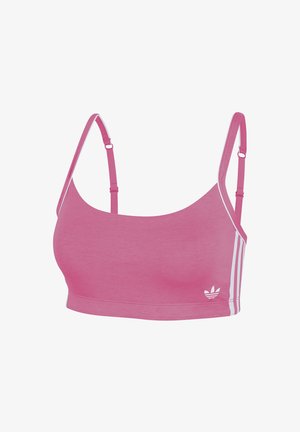 Różowy sportowy biustonosz z cienkimi ramiączkami, wykonany z gładkiej tkaniny. Posiada białe boczne paski i małe logo z przodu, oferując nowoczesny design.