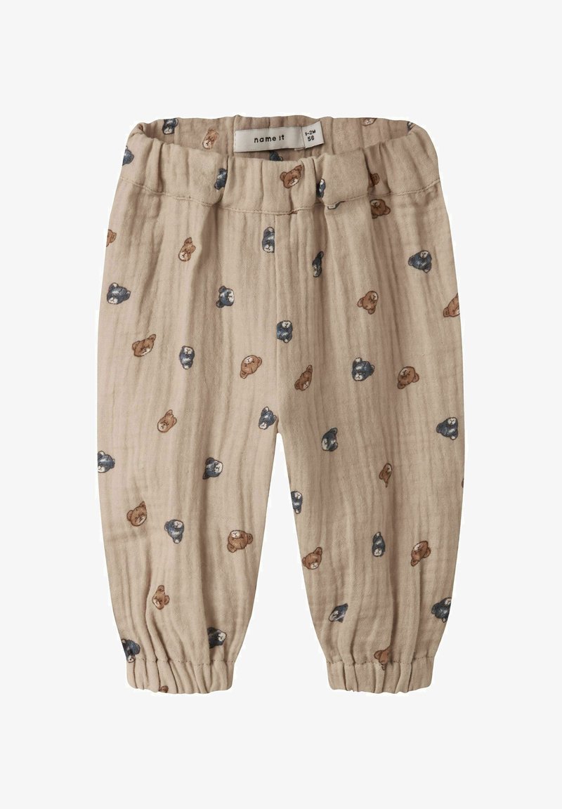 Pantalon bébé beige à taille élastique avec chevilles froncées, imprimé de petits visages d'ours marron et marine, taille 1-2 mois.