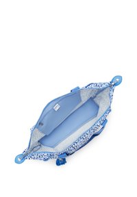 Borsa con motivo blu, interno blu, chiusura con zip e dettagli in pelle. Presenta due manici e un morbido rivestimento con motivo floreale.