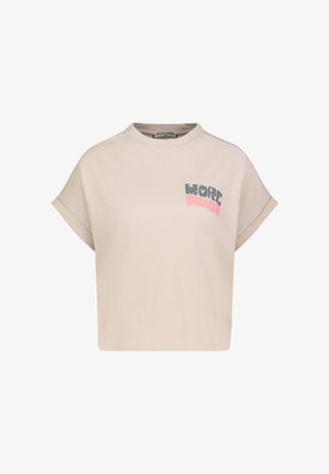 Light beige cropped T-shirt with rolled short sleeves and "MORE AMOR" text in distressed blue and pink on the left chest.