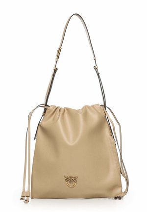 Beige leren schoudertas met trekkoordsluiting, verstelbare schouderriem en goudkleurig bijenembleem midden op de voorkant.