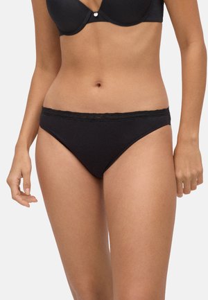 Panties de algodón negras con un borde de encaje en la cintura, con un corte clásico y una textura suave.