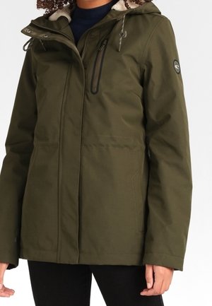 Olive green waterproof jacket with a zip front, detachable hood, and soft lining. Features pockets and logo accents. Smooth texture.