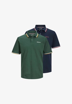 Two polo shirts, one green with yellow and red striped collar, and one navy with red and white striped collar. Both have logo on chest.