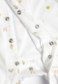 White cotton onesie featuring a playful pattern of ice creams, rainbows, and suns. Silver snap closures at the bottom for easy dressing.