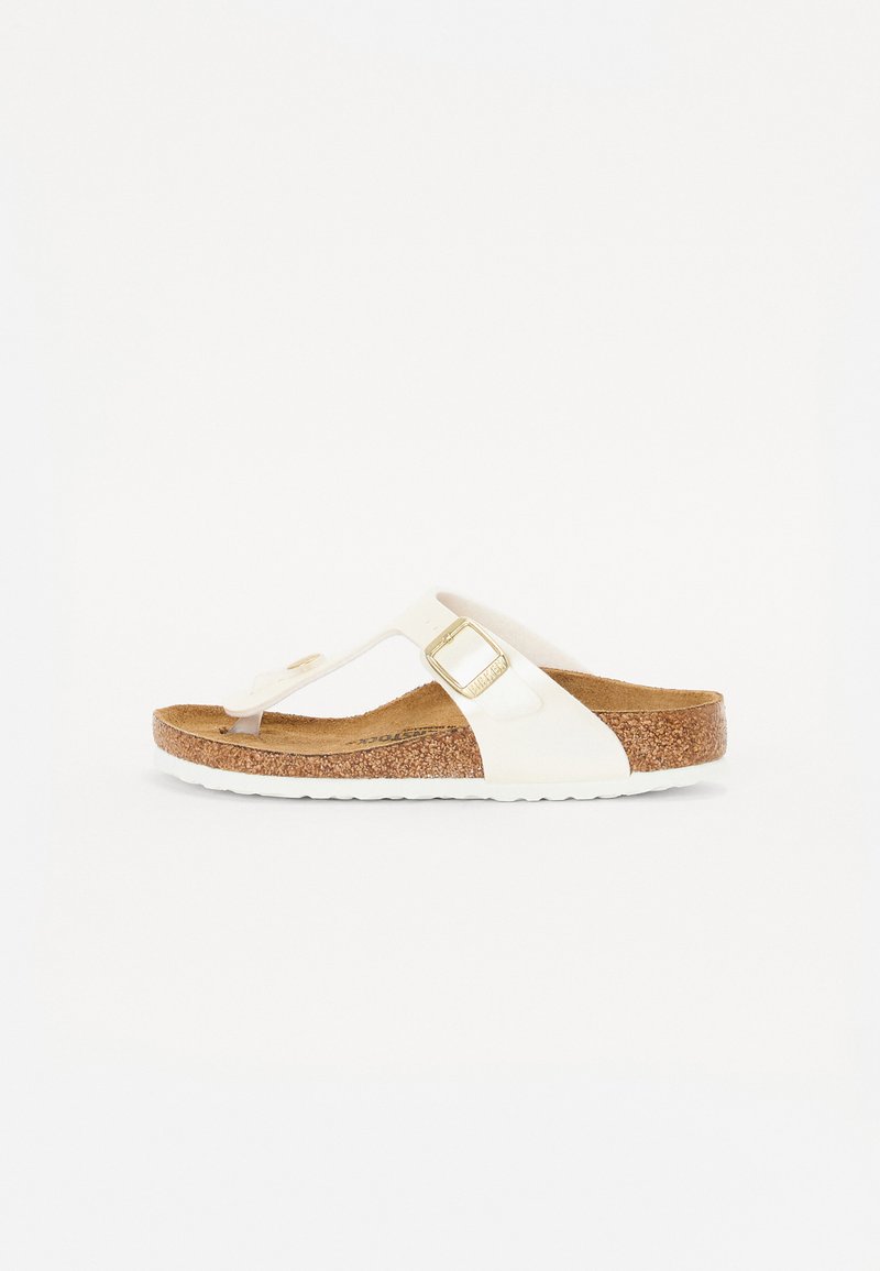 White thong-style sandal with a cork footbed, rubber sole, and gold-tone buckle accents. Smooth upper texture with a minimalist design.