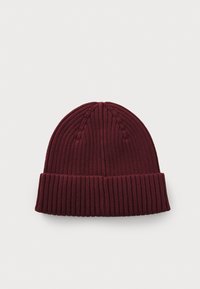 Maroon knitted beanie, featuring a ribbed texture with a folded cuff and subtle vertical seams at the top. Soft and stretchy material.