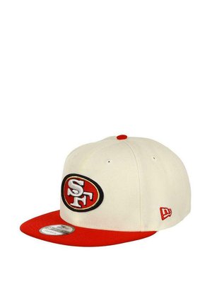 White cap with a red flat brim, featuring an embroidered black and red "SF" logo on the front. Red accent on the top button and side.