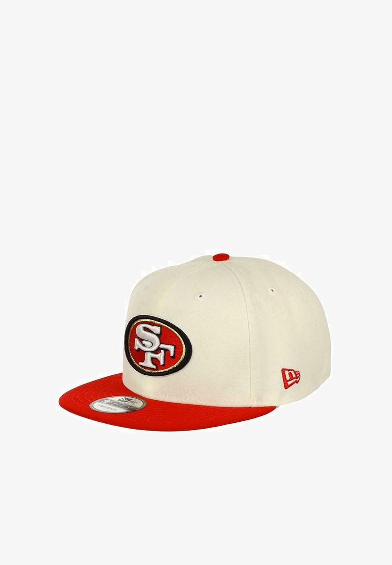 White cap with a red flat brim, featuring an embroidered black and red "SF" logo on the front. Red accent on the top button and side.