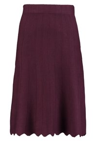 Jupe en tricot côtelé marron, de coupe mi-longue, avec un ourlet en scallop et une taille ajustée pour une silhouette structurée.