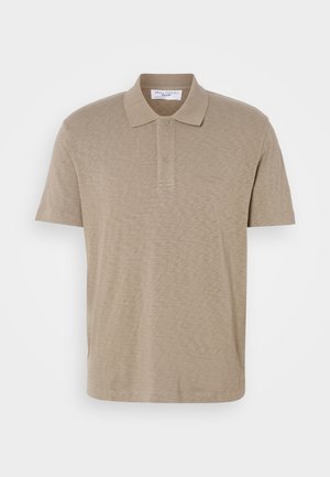 Beige polo shirt made of soft fabric, featuring a two-button placket and short sleeves. Subtle texture with a plain design and no patterns.