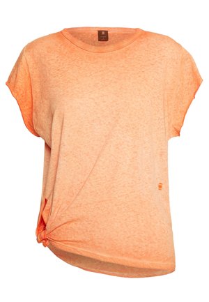 T-shirt pour femmes à manches courtes, couleur pêche orangée, col rond et détail de nœud sur le côté à l'ourlet gauche.