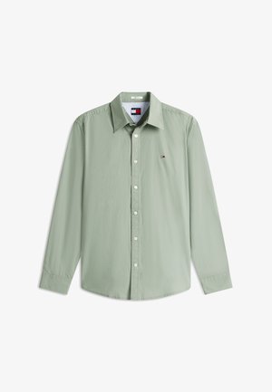 Lysegrøn langærmet skjorte med knapper, krave og lille Tommy Hilfiger-logo på venstre bryst.