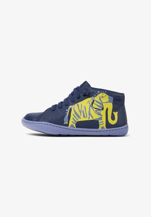 Navy blue leather sneaker with yellow and light blue elephant graphic on side, blue laces, and light blue sole.