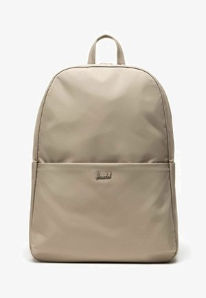 Sac à dos Herschel beige avec une poche avant et une poignée supérieure, présenté de face sur fond blanc.
