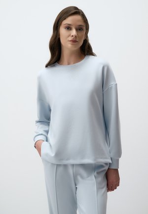 Lichtblauwe sweatshirt van zacht materiaal, met een ronde halslijn en geribbelde manchetten, gewaardeerd met een relaxed-fit ontwerp.