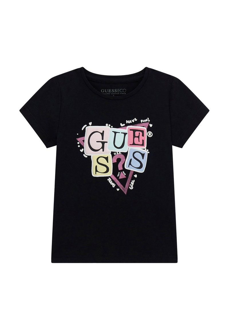 Camiseta de algodón negra con un gráfico colorido de "GUESS" con letras en tonos pastel y acentos divertidos. Diseño de manga corta y cuello redondo.