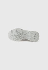 Shoe sole featuring a textured, wavy pattern in light gray with dark gray accents, made from a flexible synthetic material.
