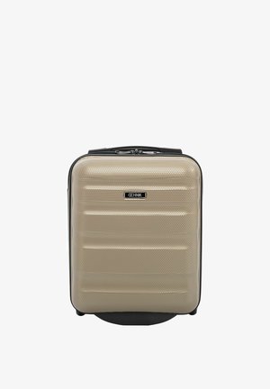 Kompaktowa beżowa walizka z twardą powłoką o fakturowanej powierzchni, czarną rączką i podwójnym zamkiem błyskawicznym, stojąca pionowo na białym tle.