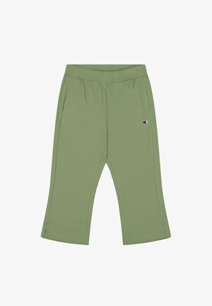 Pantaloni cropped in cotone verde con elastico in vita, due tasche laterali e un'etichetta con logo sul lato sinistro. Tessuto liscio.