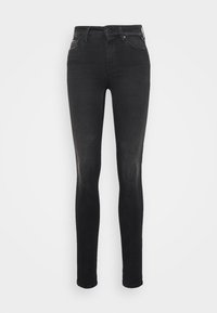 Jeans skinny negros con una textura suave, cintura alta, diseño clásico de cinco bolsillos y un ligero desgaste en los muslos, hechos de un material de denim elástico.