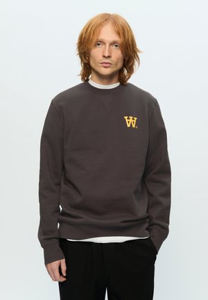Brown sweatshirt with a crew neckline, featuring a yellow logo on the chest. Long sleeves, ribbed cuffs, and medium weight fabric.
