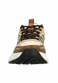 Sneakers featuring a beige and brown color scheme, mesh and suede materials, black laces with orange accents, and a textured rubber sole.