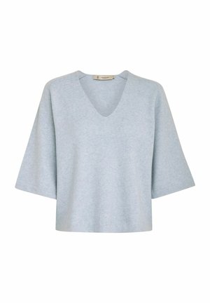 Lyseblå, kortærmet top med V-udskæring, lavet af blødt, tekstureret stof. Kasseformet med en afslappet pasform, minimal syning.