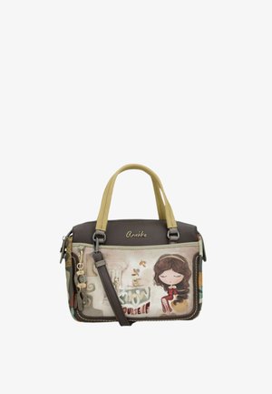 Piccola borsa a mano con manici beige e marroni, con illustrazione di una bambina dei cartoni animati, portachiavi e la frase "Conosci te stesso."