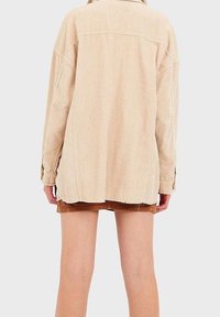 Stradivarius Pitkä takki - light brown