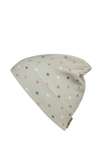 Beanie hat in soft light green fabric featuring a repeated paw print pattern in red, green, blue, and white. Relaxed, slouchy fit.