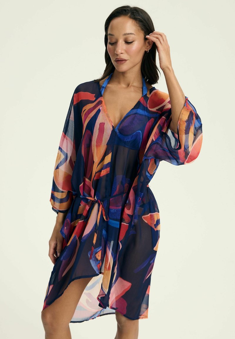 Sheer navy cover-up with multicolored abstract pattern, V-neck, wide sleeves, and a tied waist. Lightweight fabric with a flowing design.