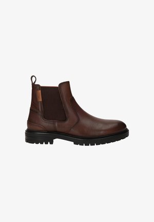 Bruine leren Chelsea-boot met elastische zijkanten, een treklipje en een gestructureerde afwerking op een robuuste zwarte zool.