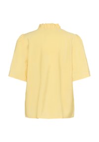 Blouse jaune à manches courtes avec un col à volants, texture lisse et coupe décontractée. Sans motifs visibles ni éléments métalliques.