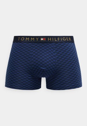 Modré kárované boxerky z měkké látky; mají černý pas s zlatým logem "TOMMY HILFIGER".