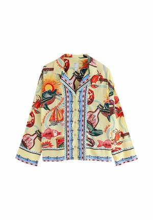 Īsroku krekls gaiši dzeltenā audumā ar izteiksmīgām, krāsainām jūras veltēm un jūras motīviem, ar negludu apkakli un pogu priekšpusi.