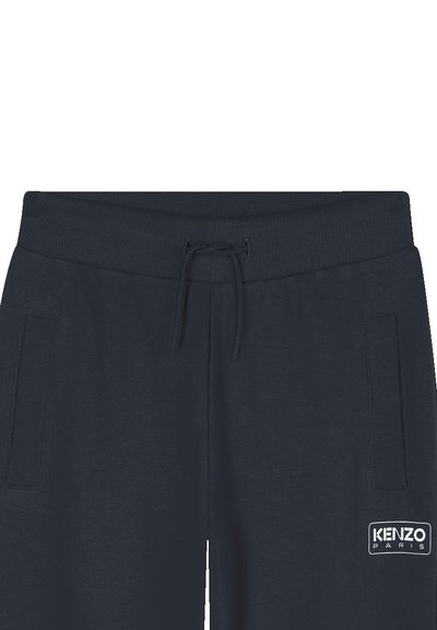 Navyblauwe joggingbroek met een geribde tailleband, trekkoord en zijzakken. Bevat een witte KENZO PARIS logo patch aan de linkerkant.