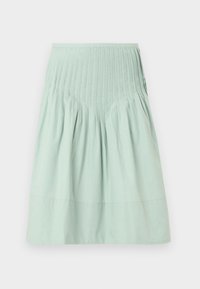 Φούστα από βαμβάκι σε ανοιχτό πράσινο χρώμα με σχεδιασμό με σούρες και ζώνη με πιέτες. Το τελείωμα είναι ίσιο, με ομαλή υφή και χωρίς εμφανή σχέδια.