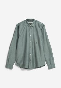 Chemise à manches longues boutonnée vert pâle avec col boutonné et petit logo brodé sur la poitrine gauche.