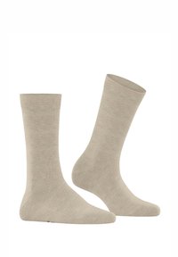 Calzini in cotone beige con una texture liscia, lunghezza a metà polpaccio, polsini a coste e punta e tallone rinforzati per una maggiore durabilità.