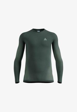 Dark green long-sleeve athletic shirt with gradient dotted pattern on sleeves and sides, featuring a small logo on the left chest.