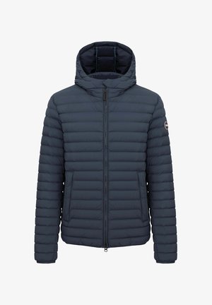 Navy blue padded jacket with horizontal quilting, front zipper, attached hood, side pockets, and logo patch on the left sleeve.