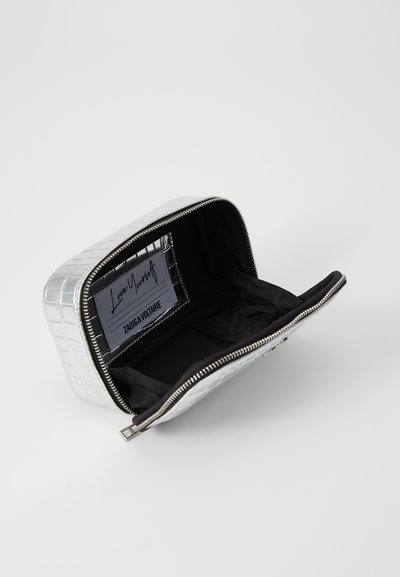 Silver cosmetic case, rectangular shape, embossed pattern, zip closure, black interior lining, interior label visible.