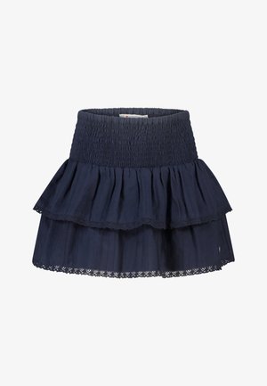 Mini-jupe bleu marine à volants avec taille smockée et bordure en dentelle sur les couches froncées.